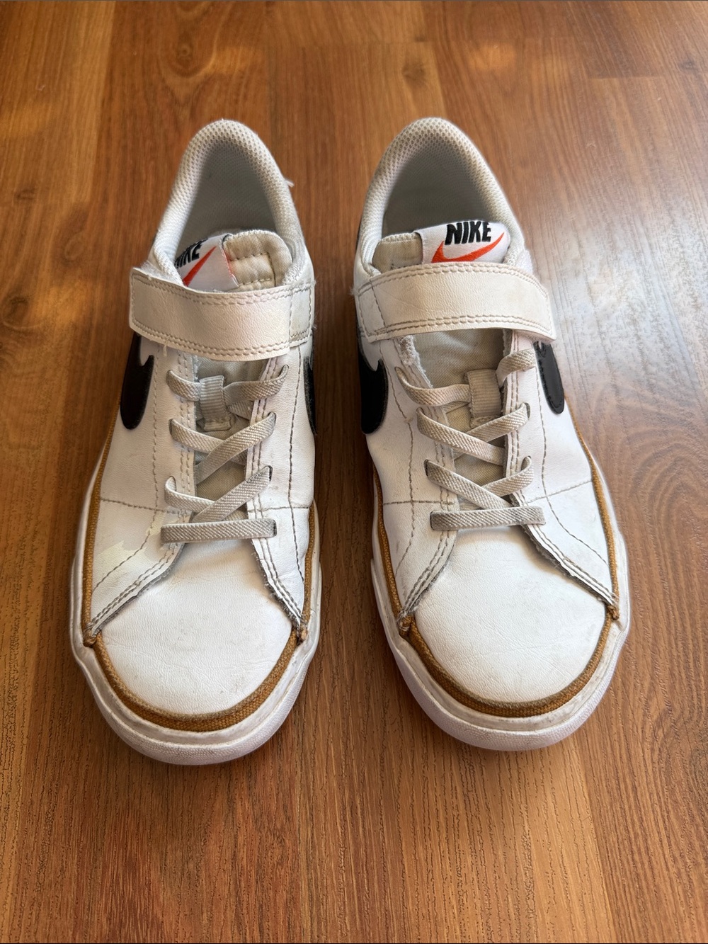 Nike Kids White Sneakers with Black Swoosh and Brown Trim